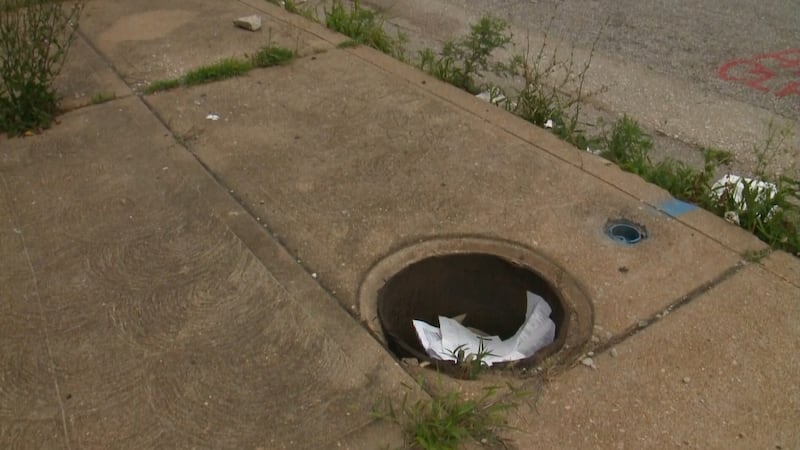 Jamie Hassan says she fell into an open manhole while walking toward a bar on a north St....