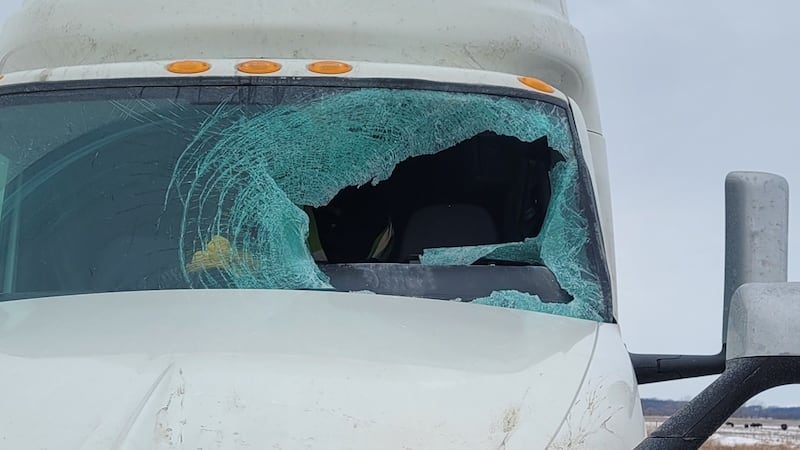 A semitruck driver escaped serious injury after a flying ice chunk flew off the top of a van...