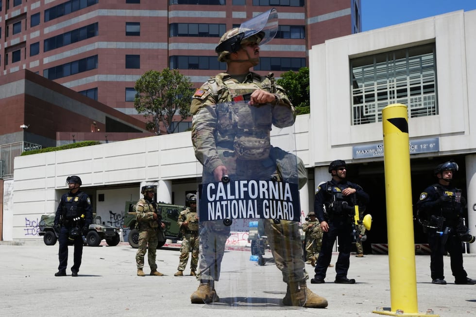 U.S. National Guard stand protect buildings Tuesday, June 10, 2025, in Los Angeles.