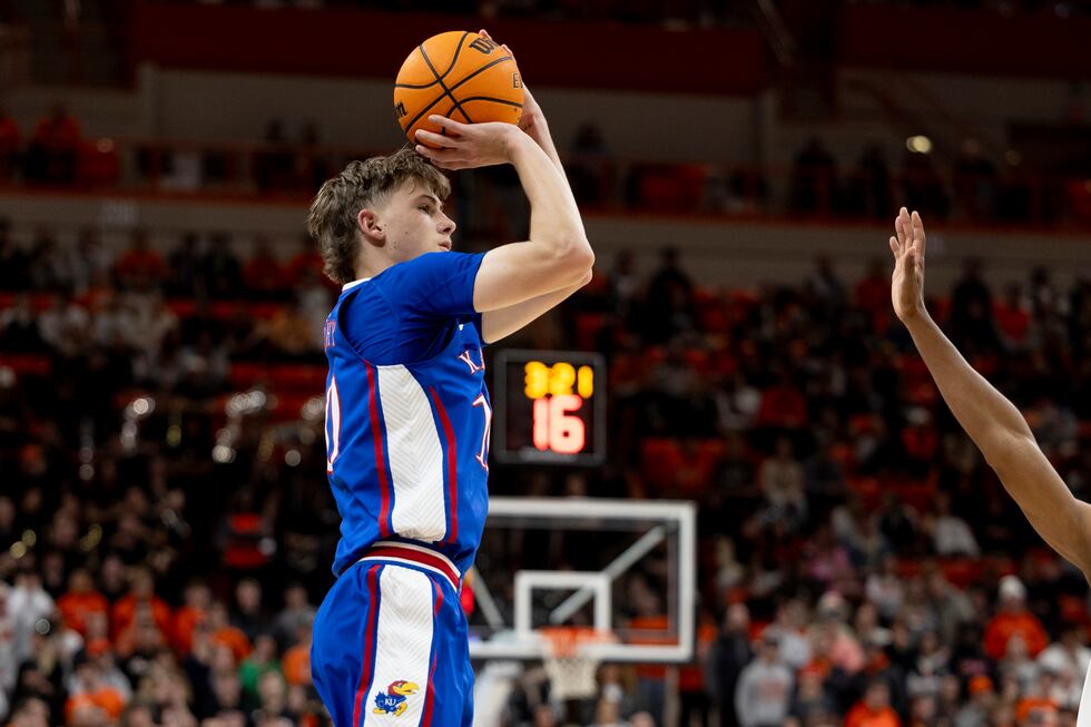 Kansas guard Johnny Furphy (10) shoots the ball in the first half of an NCAA college...