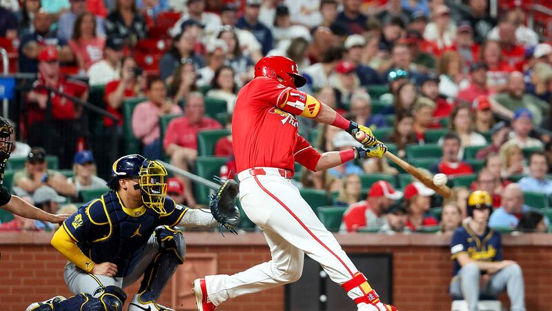St. Louis Cardinals' Lars Nootbaar, right, hits an RBI single during the fifth inning of a...