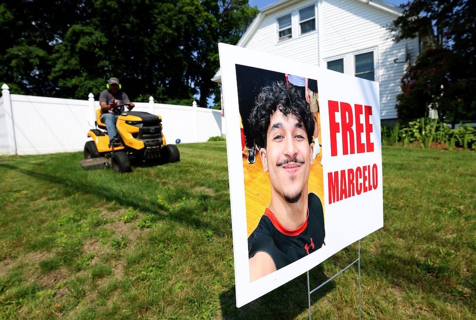 A homeowner around a sign ing Marcelo Gomes Da Silva, who was arrested on his way to...