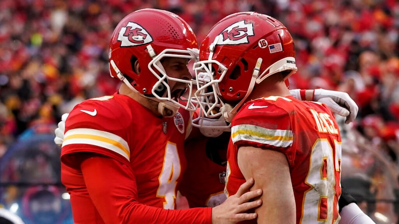 Kansas City Chiefs tight end Travis Kelce (87) celebrates his touchdown with quarterback Chad...