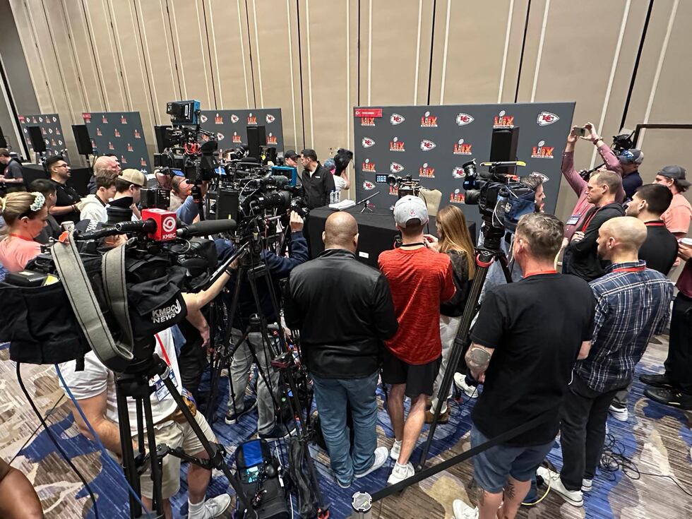 A crowd of media gathered around the table of Patrick Mahomes during media...