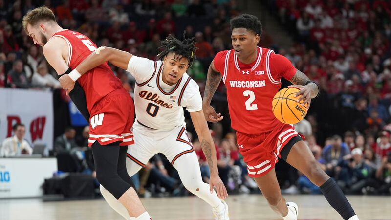 Wisconsin guard AJ Storr (2) works toward the basket as Illinois guard Terrence Shannon Jr....