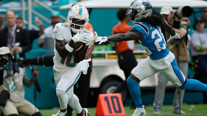Miami Dolphins wide receiver Tyreek Hill (10) grabs a for a touchdown as Carolina...