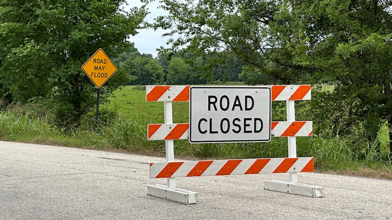 Multiple roads in Johnson County, Mo., are closed and have barricades due to flooding.