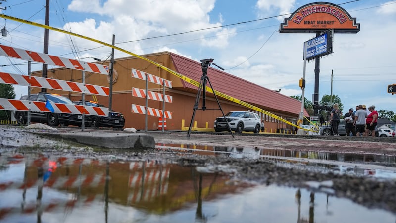 Police work on Canal Street in Houston, Tuesday, July 7, 2026, after a shooting.