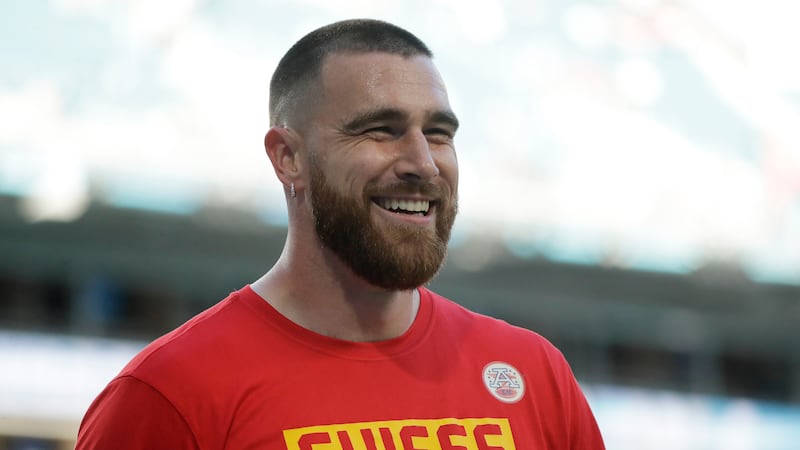 FILE - Kansas City Chiefs' Travis Kelce smiles before the NFL Super Bowl 54 football game...