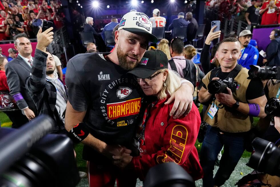 Kansas City Chiefs tight end Travis Kelce (87) hugs his mother Donna, after the NFL Super Bowl...