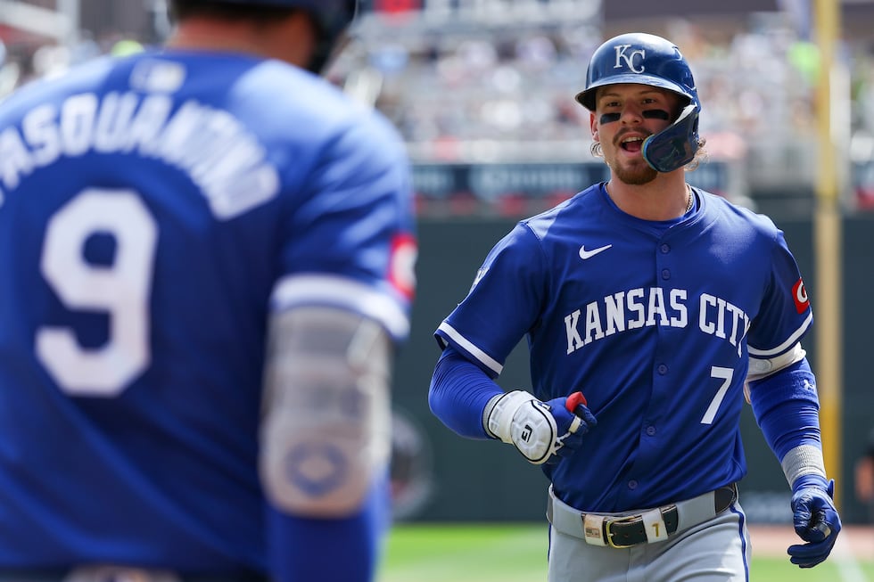 Kansas City Royals' Bobby Witt Jr., right, celebrates his solo home run with Vinnie...