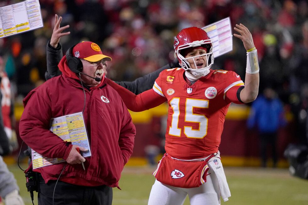 Kansas City Chiefs head coach Andy Reid, left, and quarterback Patrick Mahomes (15) react...