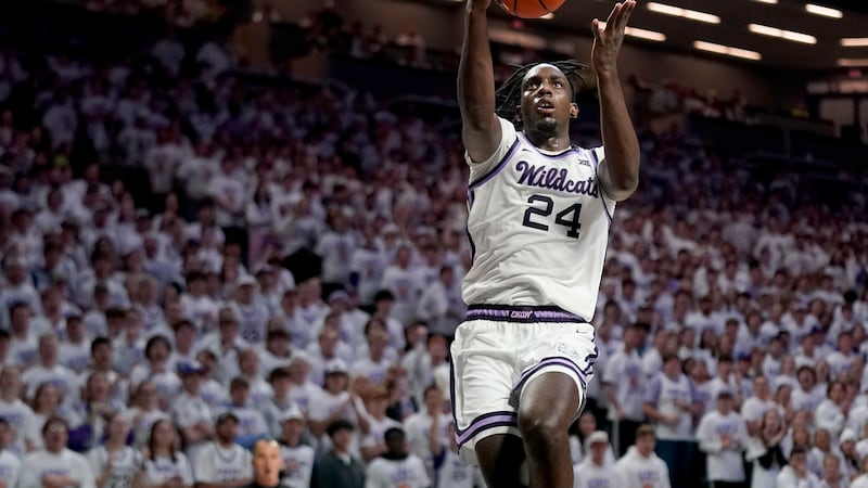 Kansas State forward Arthur Kaluma puts up a shot during the second half of an NCAA college...