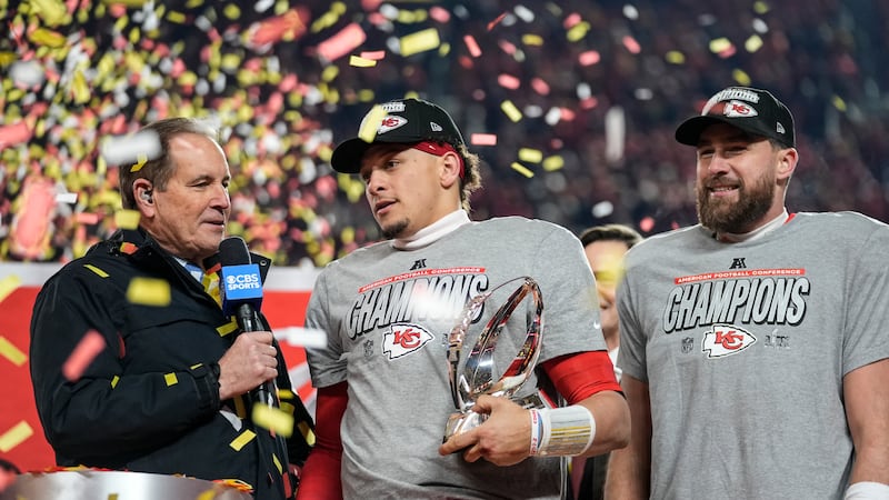 CBS broadcaster Jim Nance speaks with Kansas City Chiefs quarterback Patrick Mahomes and tight...