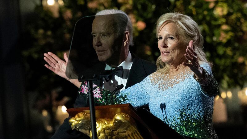 First lady Jill Biden, accompanied by President Joe Biden, speaks during a dinner of gratitude...