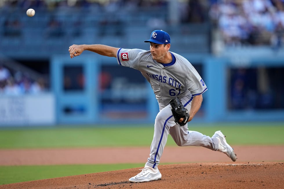 Kansas City Royals starting pitcher Seth Lugo throws to the plate during the first inning of a...