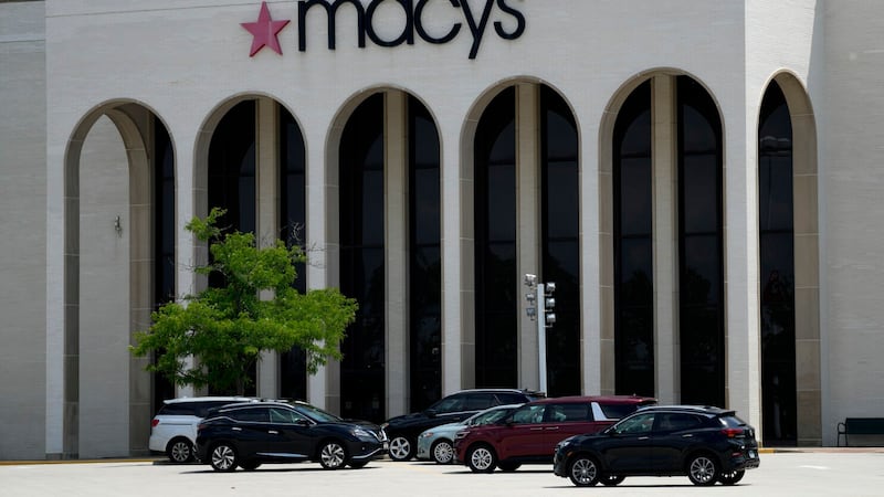 FILE - Cars are parked in front of a Macy's store at Hawthorn Mall in Vernon Hills, Ill., June...