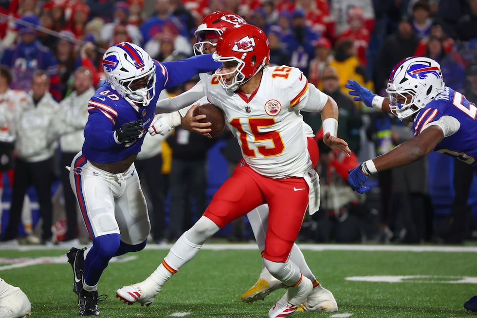 Kansas City Chiefs quarterback Patrick Mahomes (15) is pressured by Buffalo Bills linebacker...