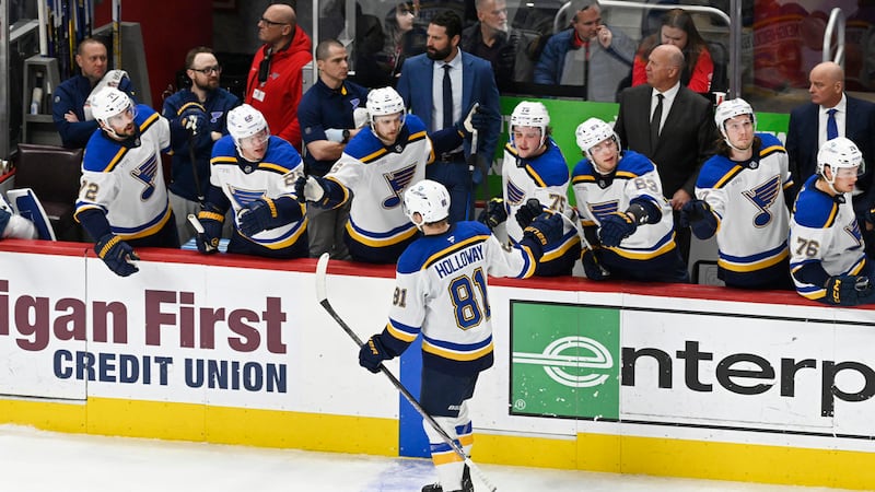 St. Louis Blues center Dylan Holloway (81) is congratulated after scoring a goal against the...