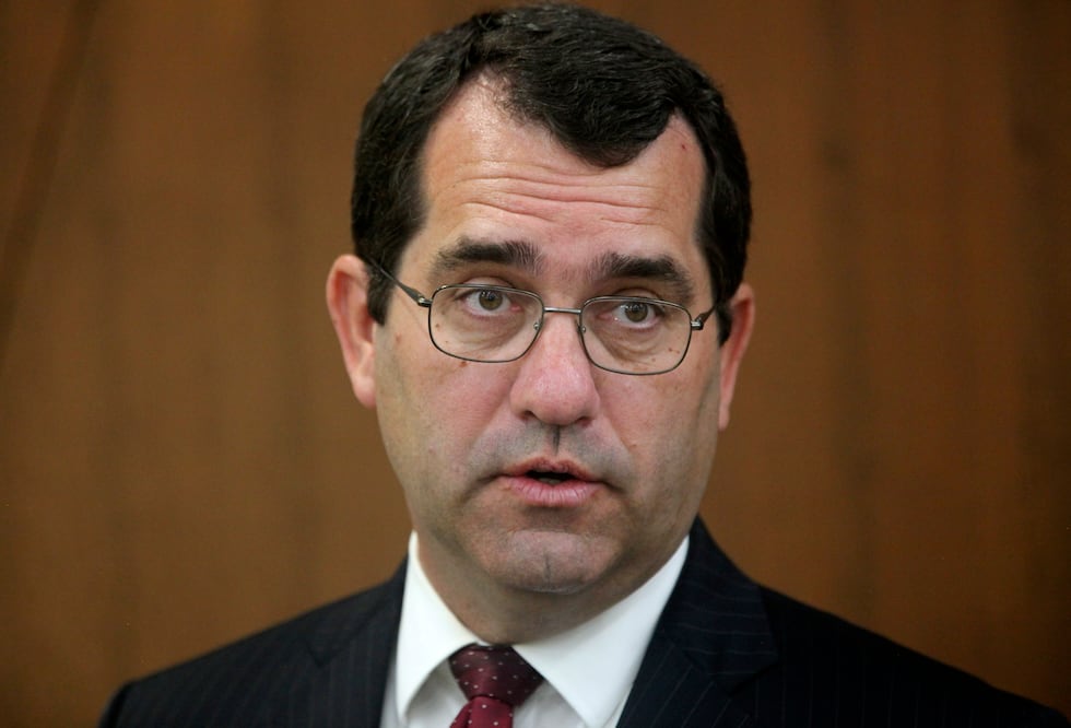 FILE - Kansas Attorney General Derek Schmidt answers questions from reporters during a news...