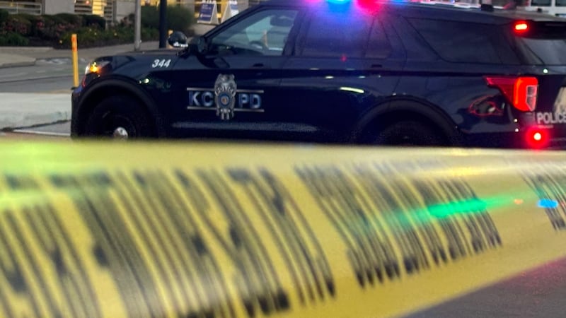 Kansas City police taped off the area near E 13th Street and Grand Boulevard to investigate a...