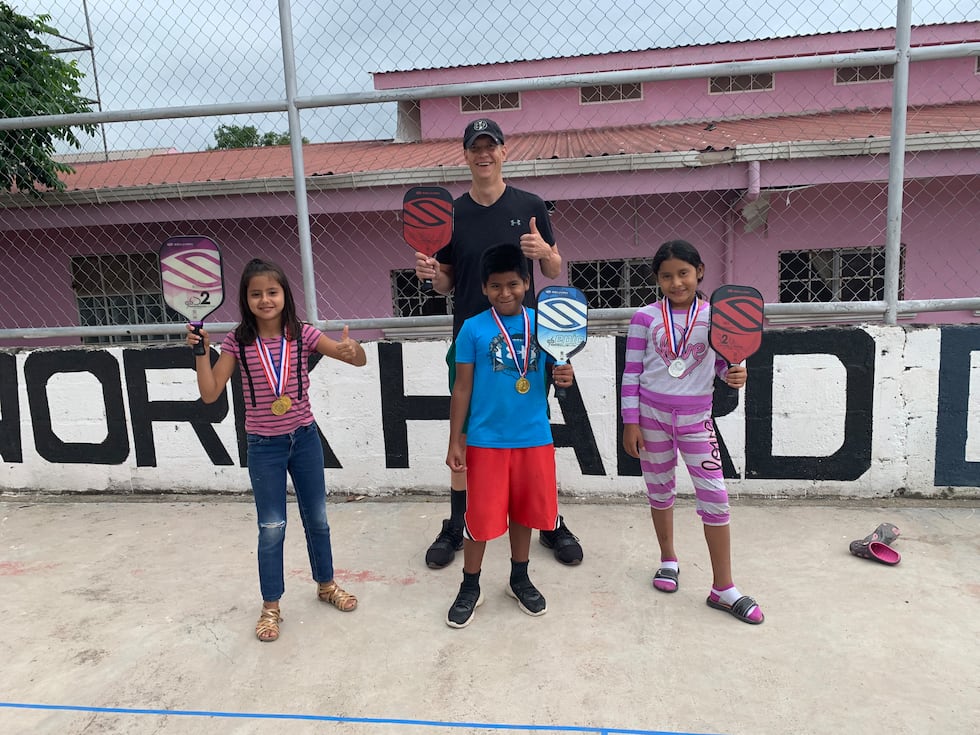 Trost teaches children in Honduras how to play pickleball