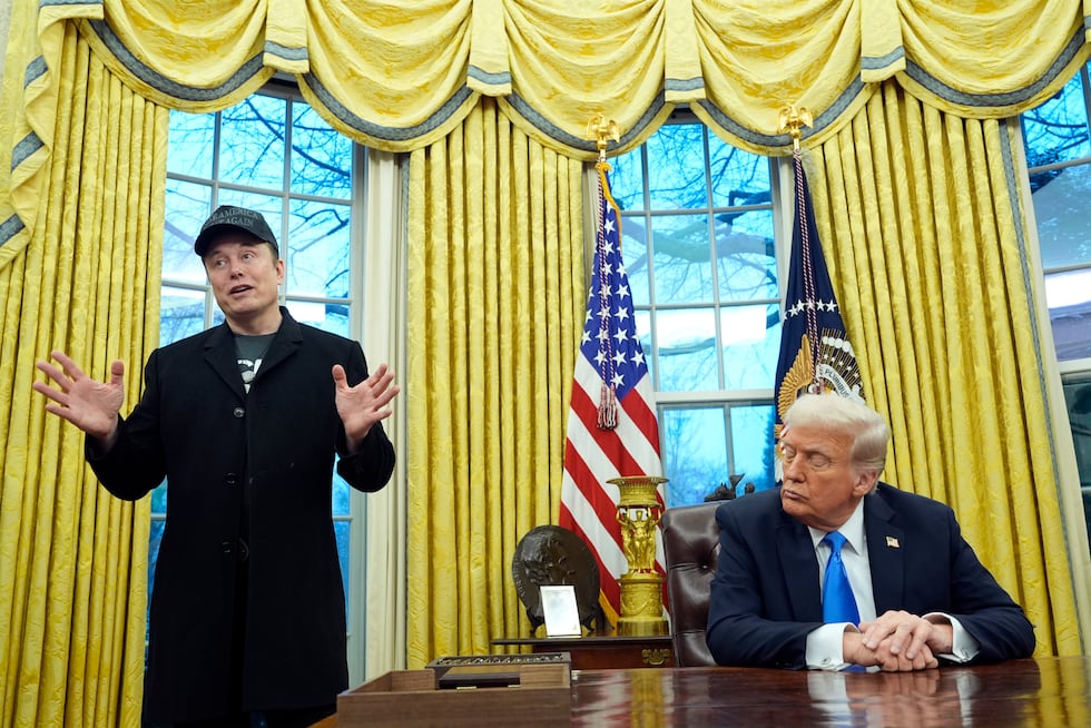 President Donald Trump listens as Elon Musk speaks in the Oval Office at the White House,...