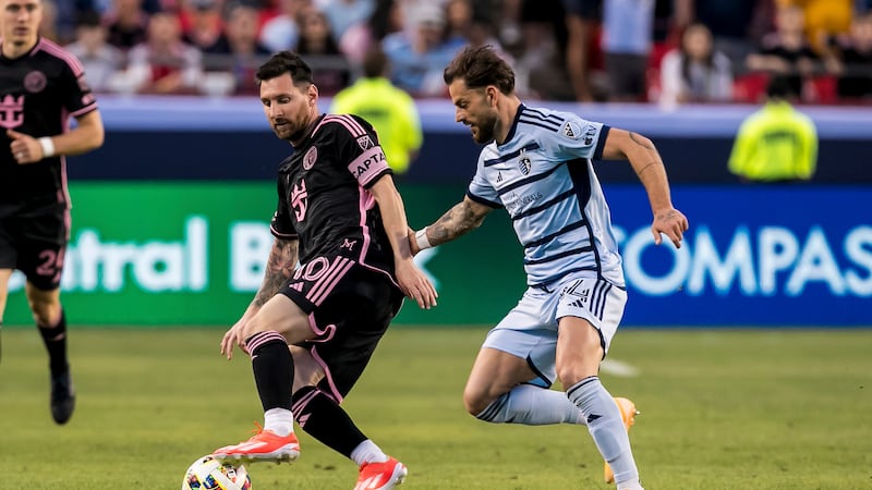 Inter Miami forward Lionel Messi (10) attempts to by Sporting Kansas City defender Tim...