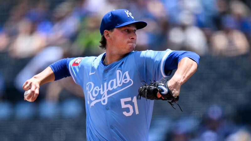Kansas City Royals starting pitcher Brady Singer delivers to a Miami Marlins batter during the...