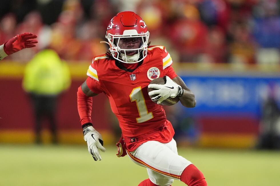 Kansas City Chiefs wide receiver Xavier Worthy (1) runs with the ball during the first half of...