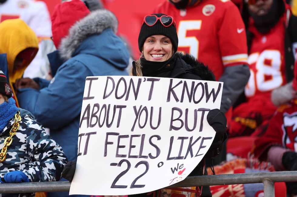 A fan holds a sign before an AFC divisional playoff game between the Kansas City Chiefs and...