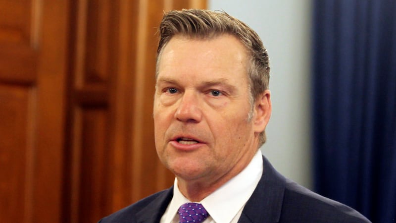 Kansas Attorney General Kris Kobach announces during a news conference that he and the...