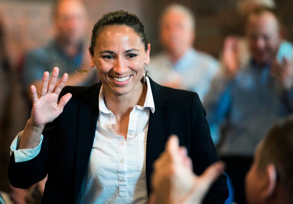FILE - In this Aug. 8, 2018, file photo, Democrat Sharice Davids waves at her ers at a...