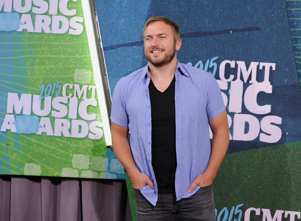 Logan Mize arrives at the CMT Music Awards at Bridgestone Arena on Wednesday, June 10, 2015,...