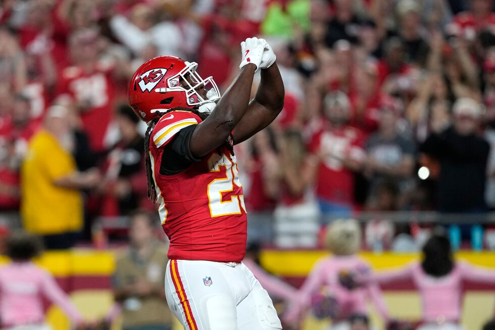 Kansas City Chiefs running back Kareem Hunt celebrates after scoring during the first half of...