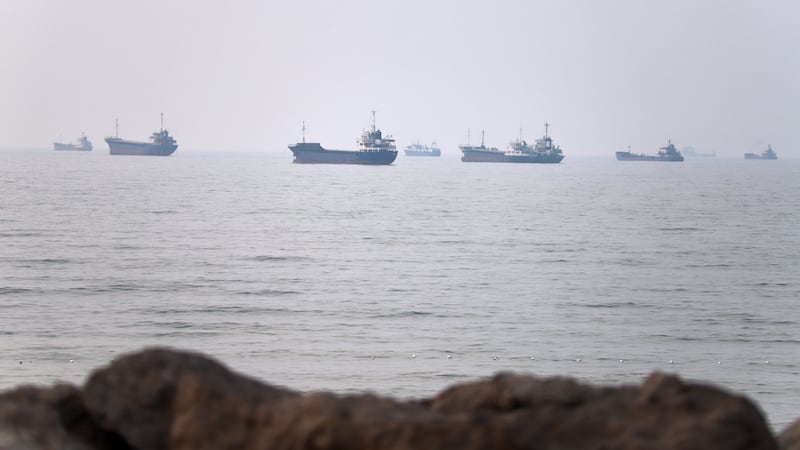 Commercial vessels are seen in the Strait of Hormuz off Bandar Abbas, Iran, Tuesday, June 30,...
