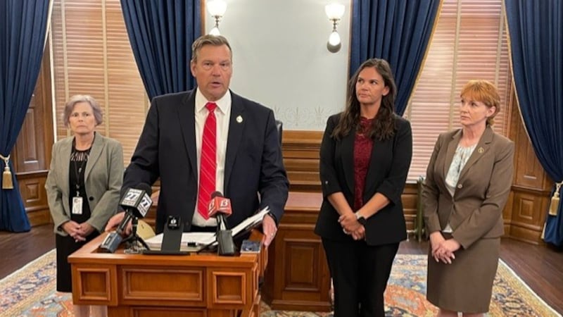 Kansas Attorney General Kris Kobach (middle left) filed a complaint claiming Pfizer misled...