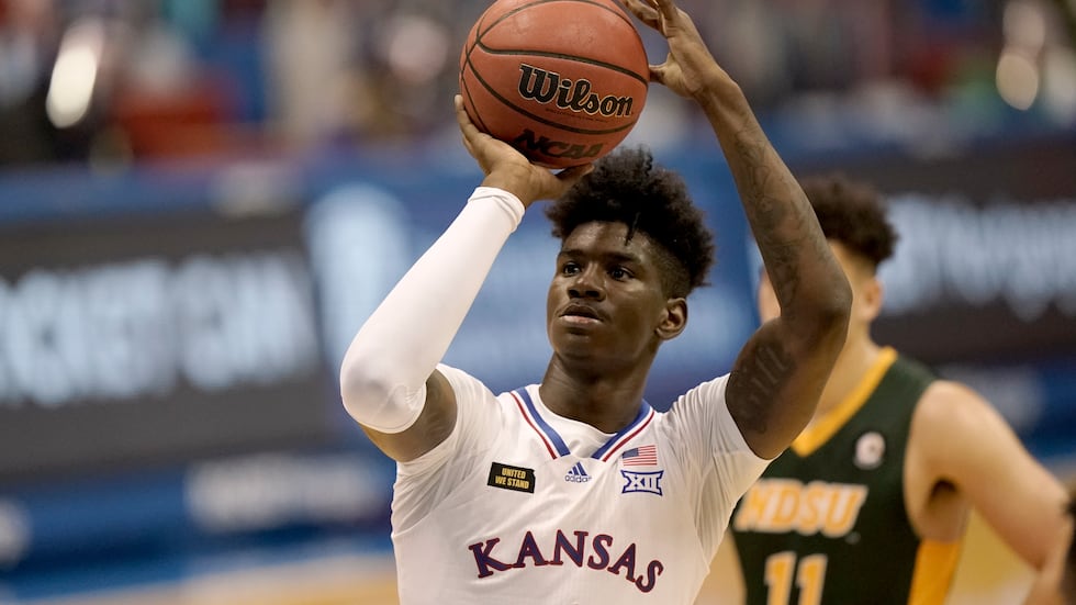 Kansas' Tyon Grant-Foster shoots during the second half of an NCAA college basketball game...