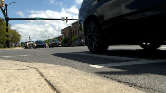 FILE - Cars driving generic