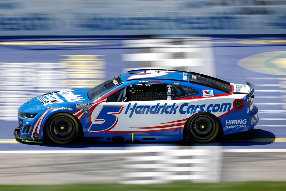 Kyle Larson crosses the start/finish line during the first stage of a NASCAR Cup Series auto...