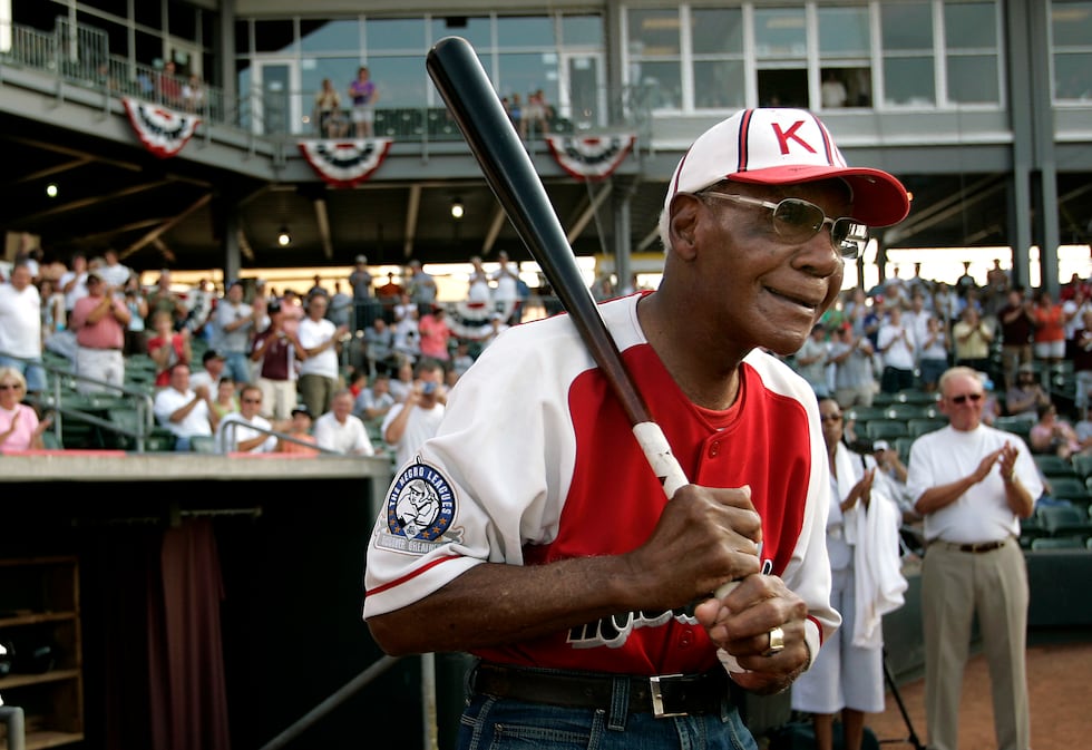 FILE - Buck O'Neil walks to the field as he is introduced before a minor league all-star game...