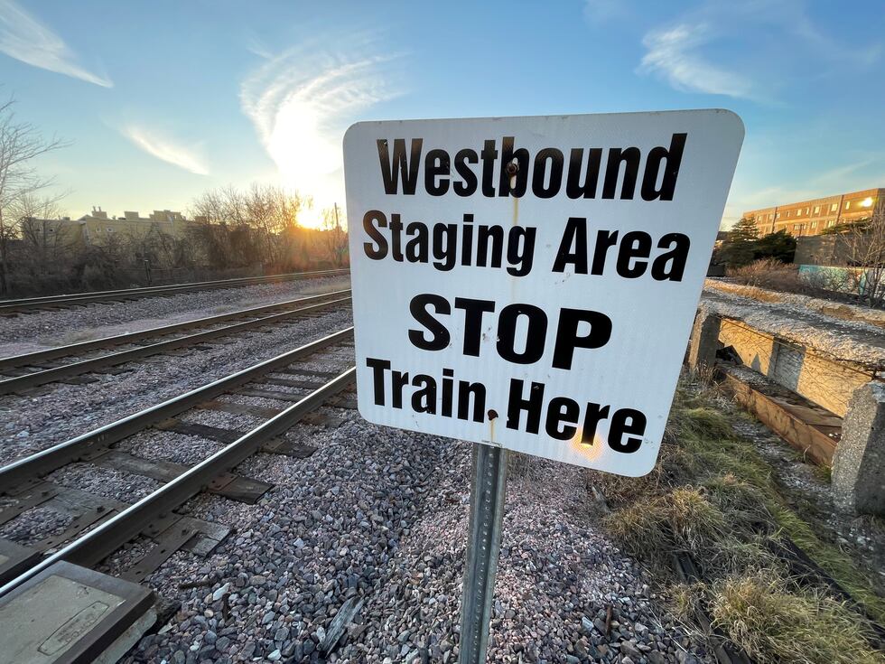 A small white sign on the tracks in Forest Park, Illinois that is difficult for of the...