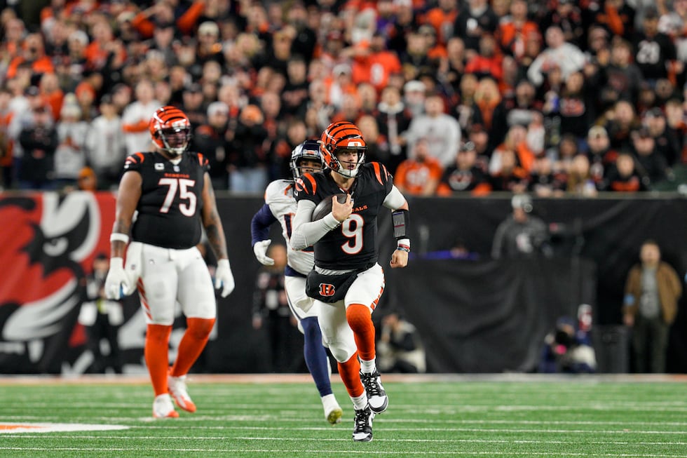 Cincinnati Bengals quarterback Joe Burrow (9) runs during an NFL football game against the...