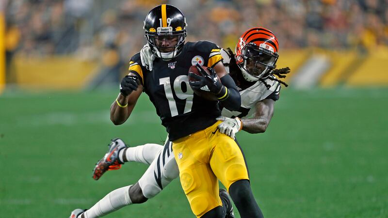 FILE -Pittsburgh Steelers wide receiver JuJu Smith-Schuster (19) is tackled by Cincinnati...