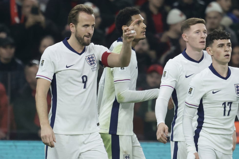 England's Harry Kane, left, celebrates with teammates after scoring his side's second goal...