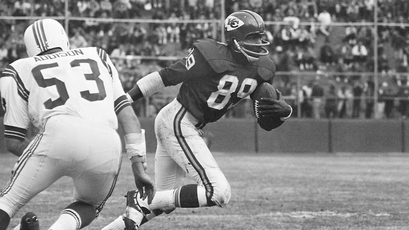 Wide receiver, Otis Taylor of the Kansas City Chiefs runs with the ball after catching a ...