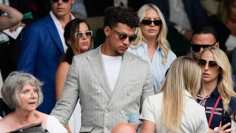 Patrick Mahomes and his wife Brittany, right, arrive on Centre Court for the third round...