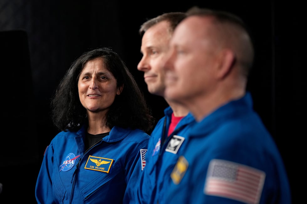 Astronauts Suni Williams, from left, Nick Hague, and Butch Wilmore are interviewed at Johnson...