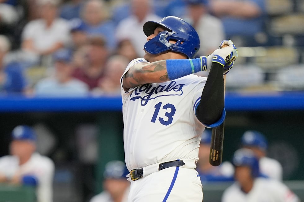 Kansas City Royals' Salvador Perez watches his three-run home run during the first inning of a...