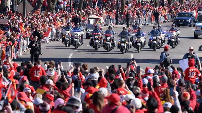 A police escort leads the Kansas City Chiefs parade to their Super Bowl victory rally in...